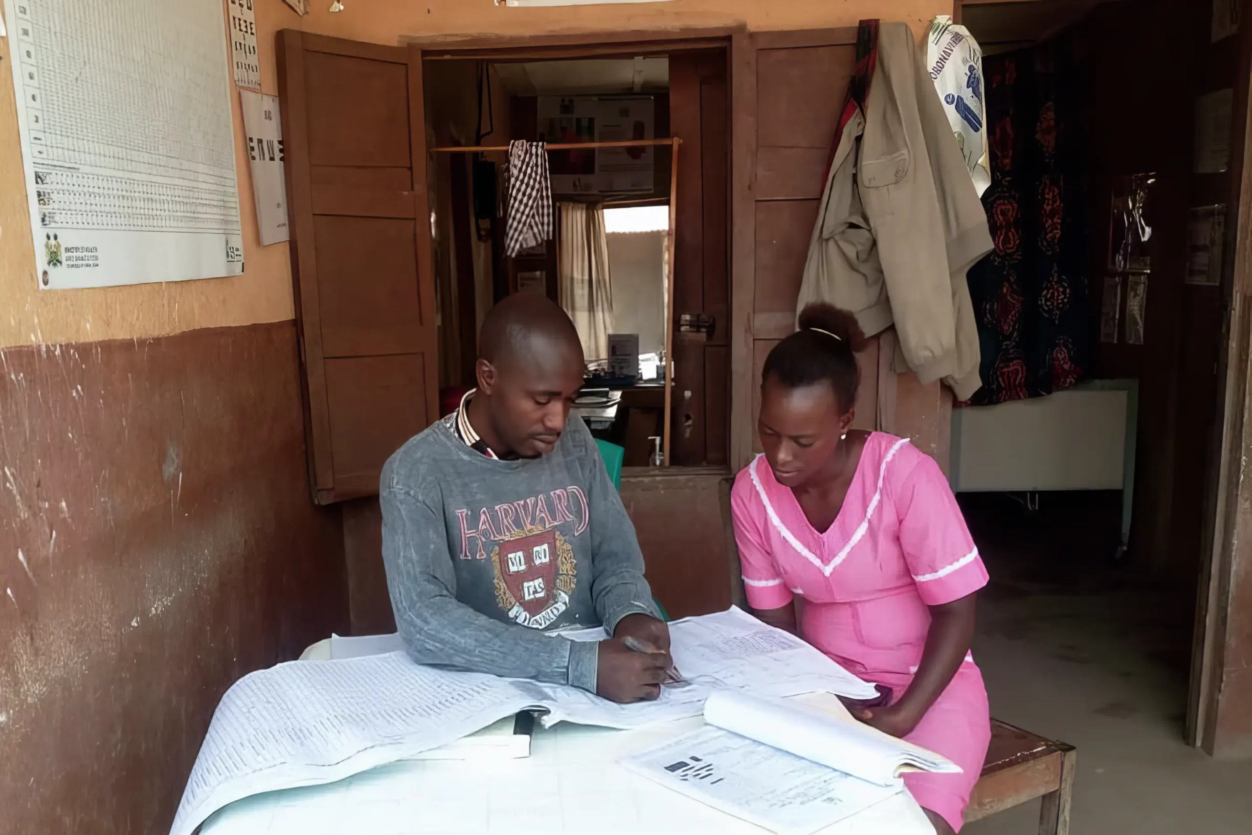 Mentorship session on reviewing the Out Patient Department registers for suspected cases of immediately reportable diseases in Sierra Leone. Credit: Resolve to Save Lives