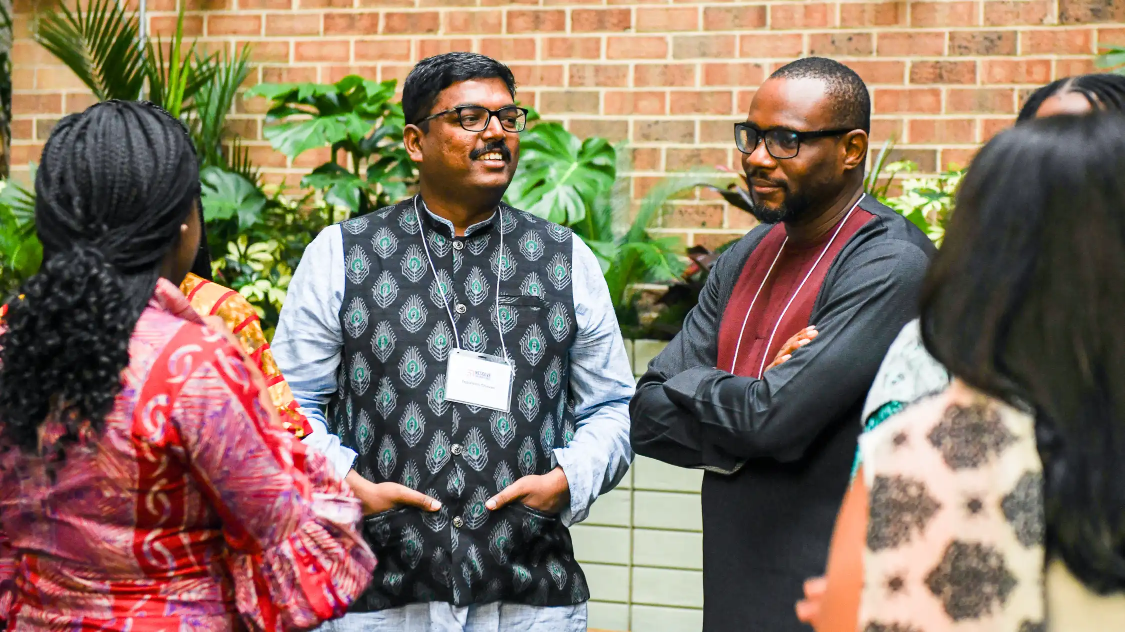 people discussing in a circle, about resolve to save lives
